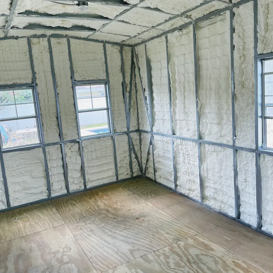 Closed-cell spray foam insulation applied to wall cavities in a residential project in Belmont